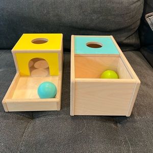 Lovevery object permanence boxes.